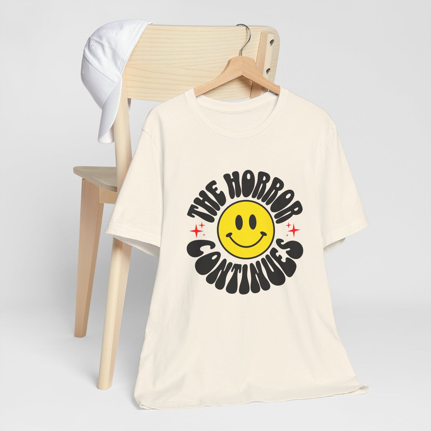 The Horror Continues Unisex Jersey Short Sleeve Tee